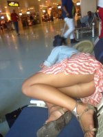 Candid-upskirt-of-a-lady-not-wearing-panties-at-the-airport.jpg